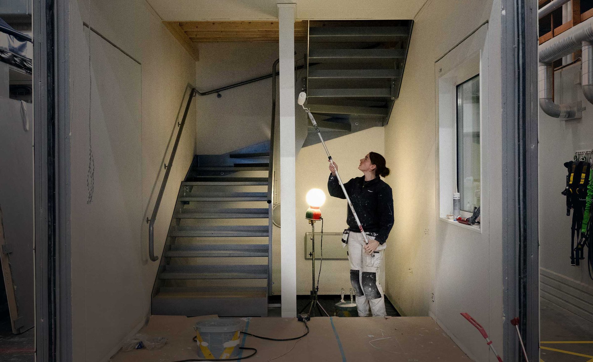 An image of an Adapteo employee painting the inside of a module